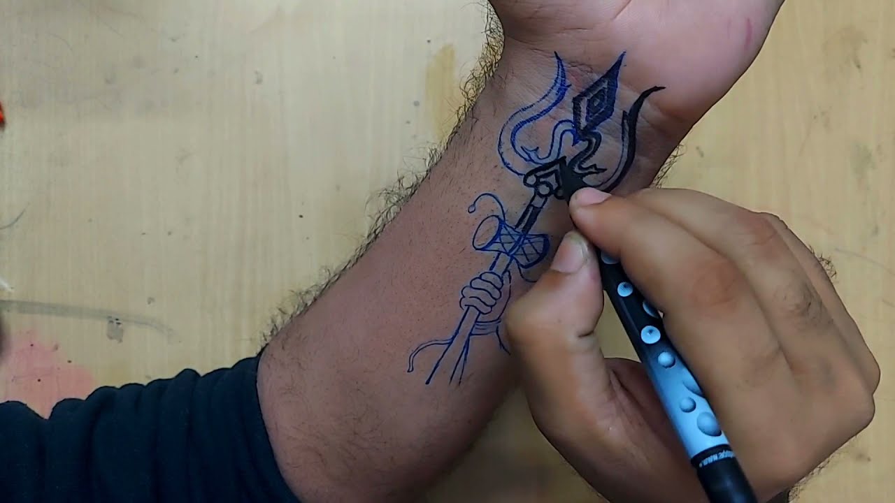 TRISHUL tattoo with text हर हर महादेव.